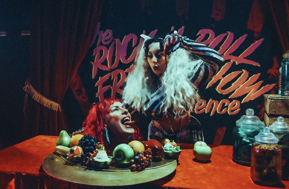 Crowd with raised fists at a Rock N' Roll Freak Show night in Brixton
